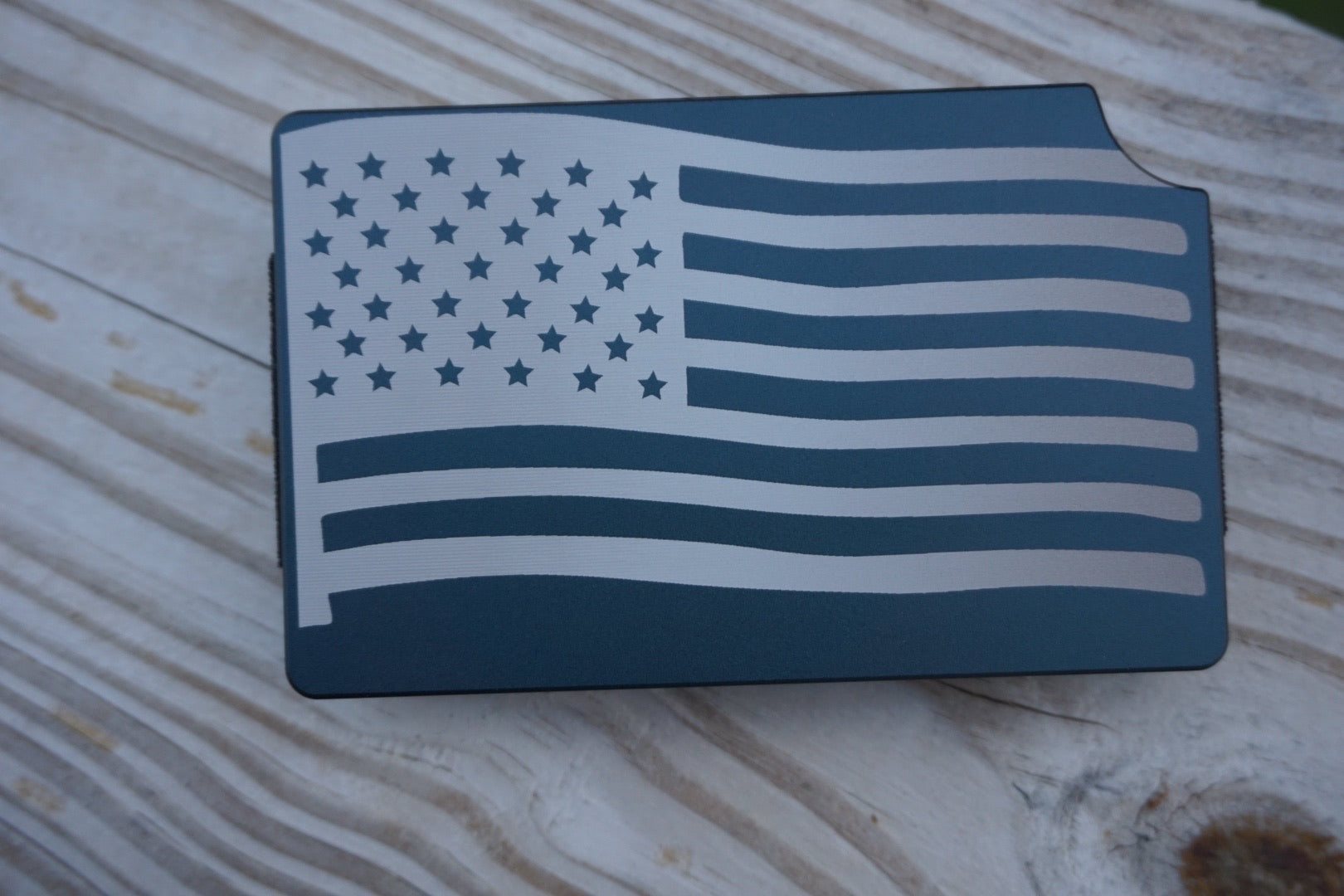 American flag design on a blue background, placed on a wooden surface.